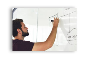 screenshot of a guy drawing on a board
