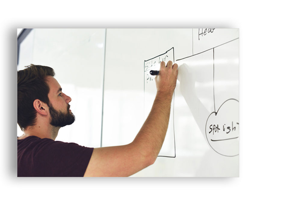 screenshot of a guy drawing on a board